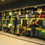 名古屋PARCO(パルコ)地下のデザインされた壁面に設置された絶滅危惧種の公衆電話台