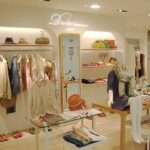 アパレル店舗デザイン設計事例、ドロワットロートレアモン(droite-lautreamont)小田急百貨店新宿店、アーチの連続する店内の写真