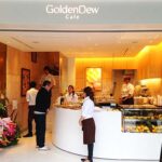 店舗デザイン設計事例-飲食店マンゴーカフェ-goldendew-cafe-神戸元町-ゴールデンデューカラーのグラデーションの壁で包まれたオーダーカウンター