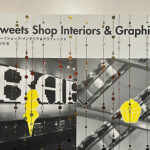 店舗デザインを担当したコンツェルト コムサストア梅田を掲載頂いた、店舗インテリアからパッケージ・グラフィック・そしてディスプレイまで、すべてのデザインを結集、融合させ、一歩先を行くスイーツショップ22店をセレクトしたスイーツショップ・インテリア&グラフィックスの本の表紙